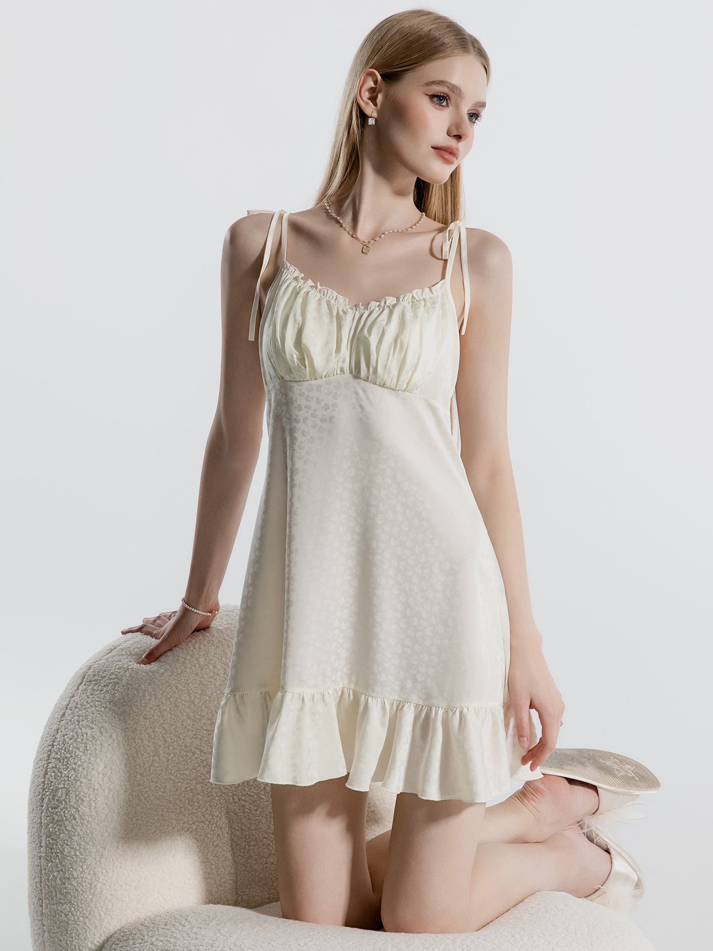White floral jacquard ruffle hem nightgown seated view