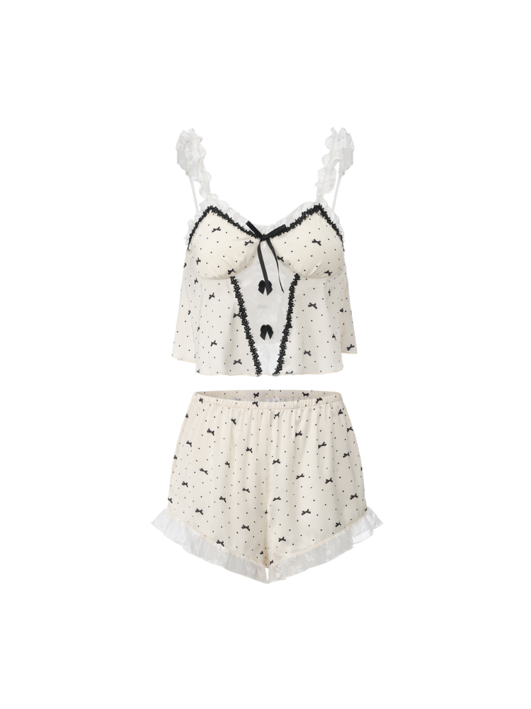 Ivory bow print camisole and shorts laid flat showing black trim and lace ruffles