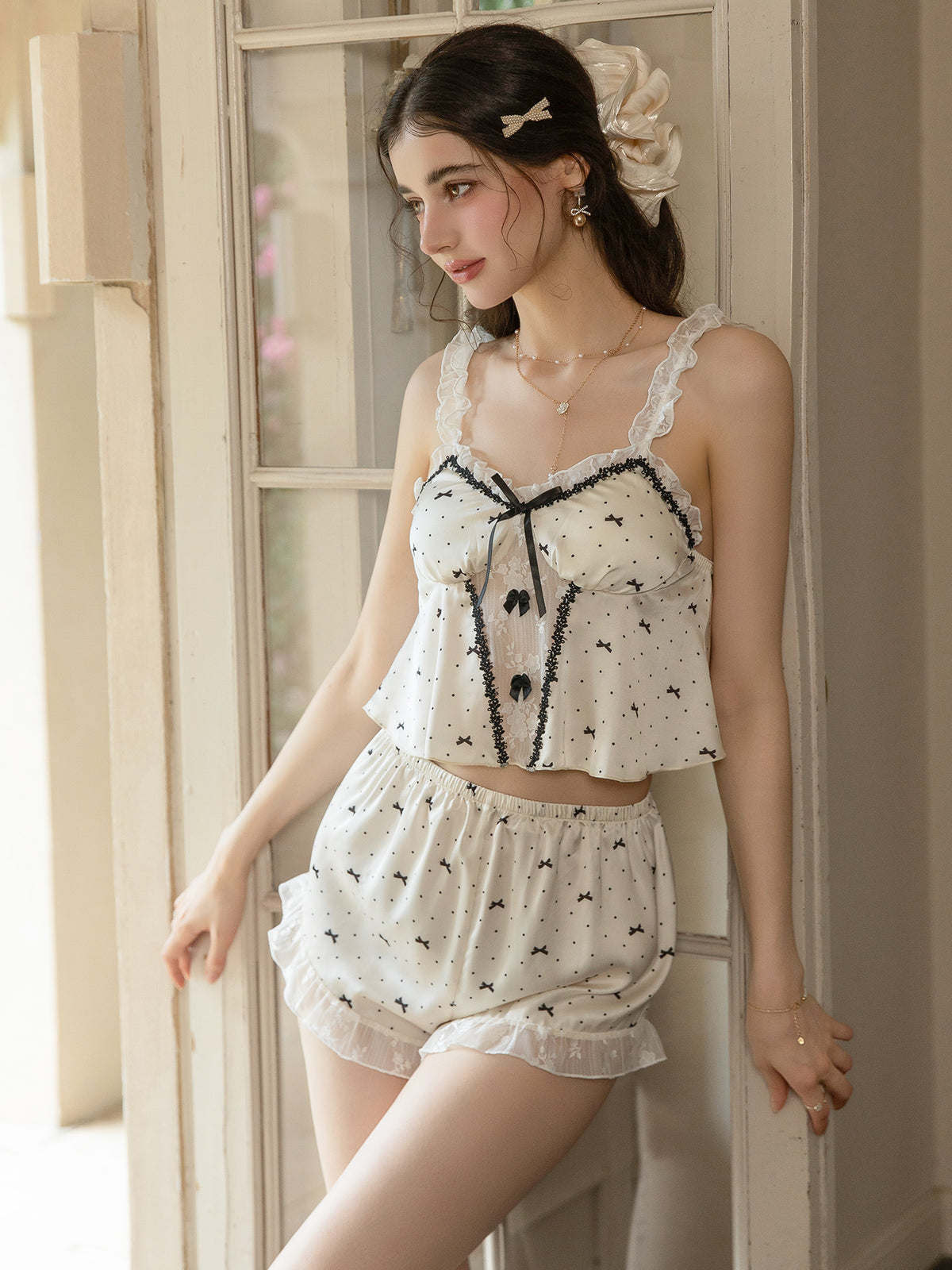 Front view of ivory bow print camisole shorts pajama set