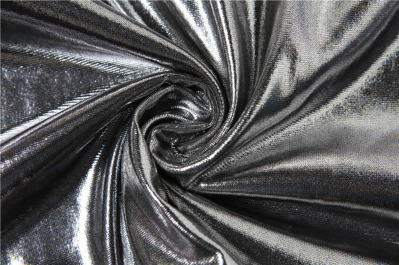Close-up of metallic silver fabric with a swirl pattern