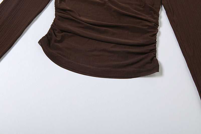 Brown long-sleeve shirt on a white background