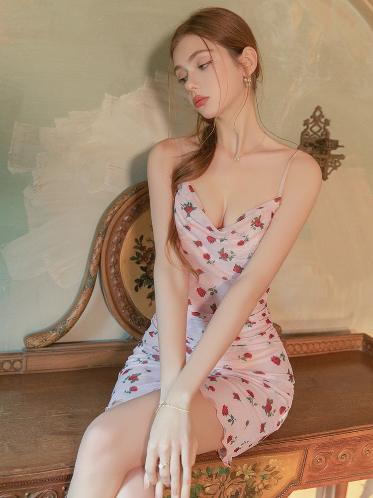 Woman in a Pink Rose Floral Mesh Ruched Mini Dress sitting on an ornate chair with a decorative wall in the background