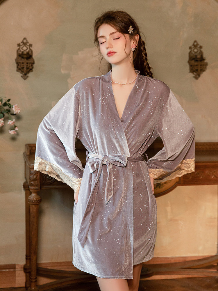 Woman wearing a Sparkle Velvet Sheer Lace Panel Slip Dress in a vintage-style room.