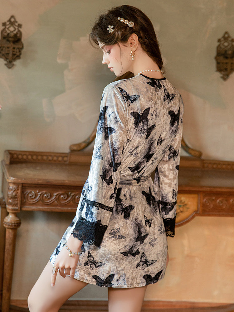 Woman wearing a Butterfly Print Lace Trim Velvet Slip Dress in an elegant room.