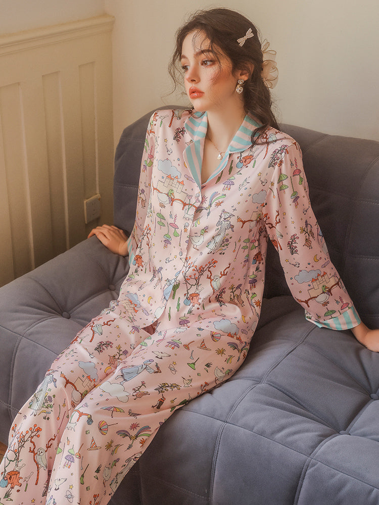 pink cartoon pajama sets front view seated on couch