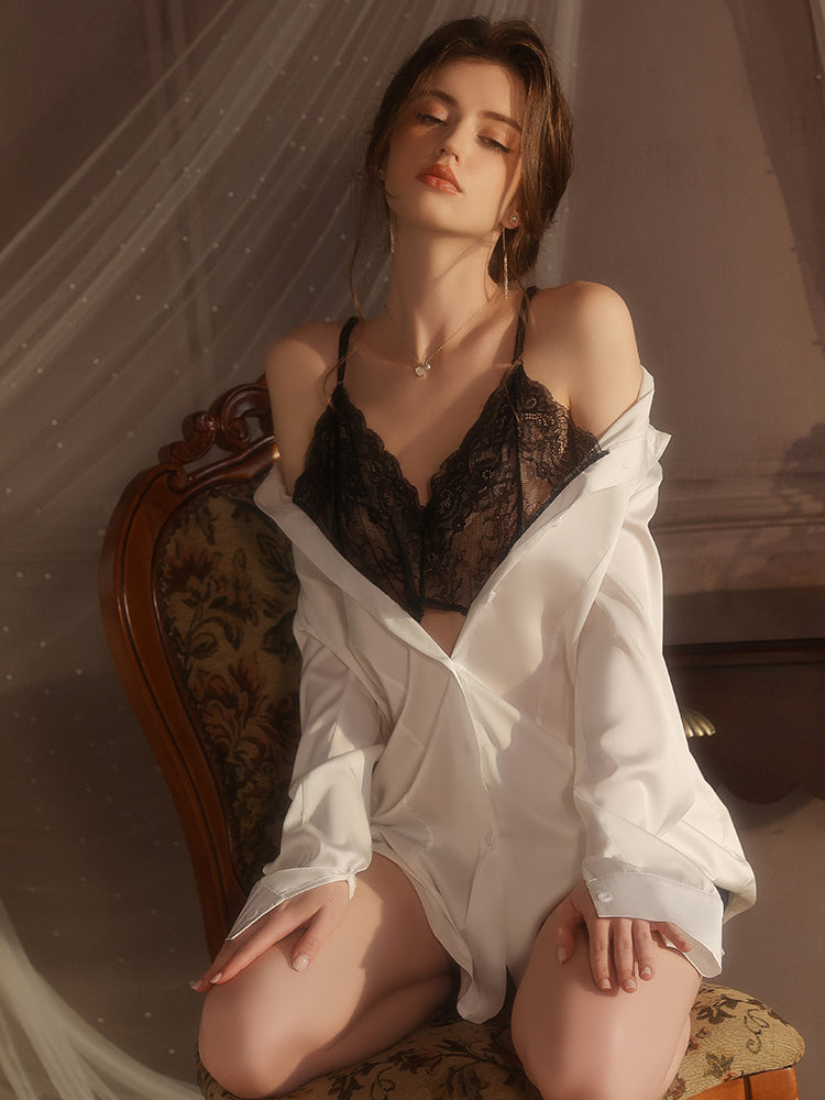 Woman in black lace lingerie and a white shirt sitting on a vintage chair.