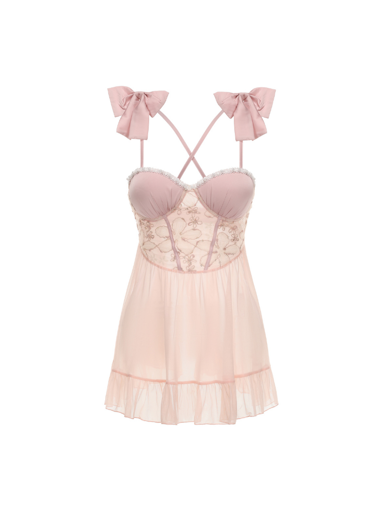 Pink lace nightgown with bow straps on a white background