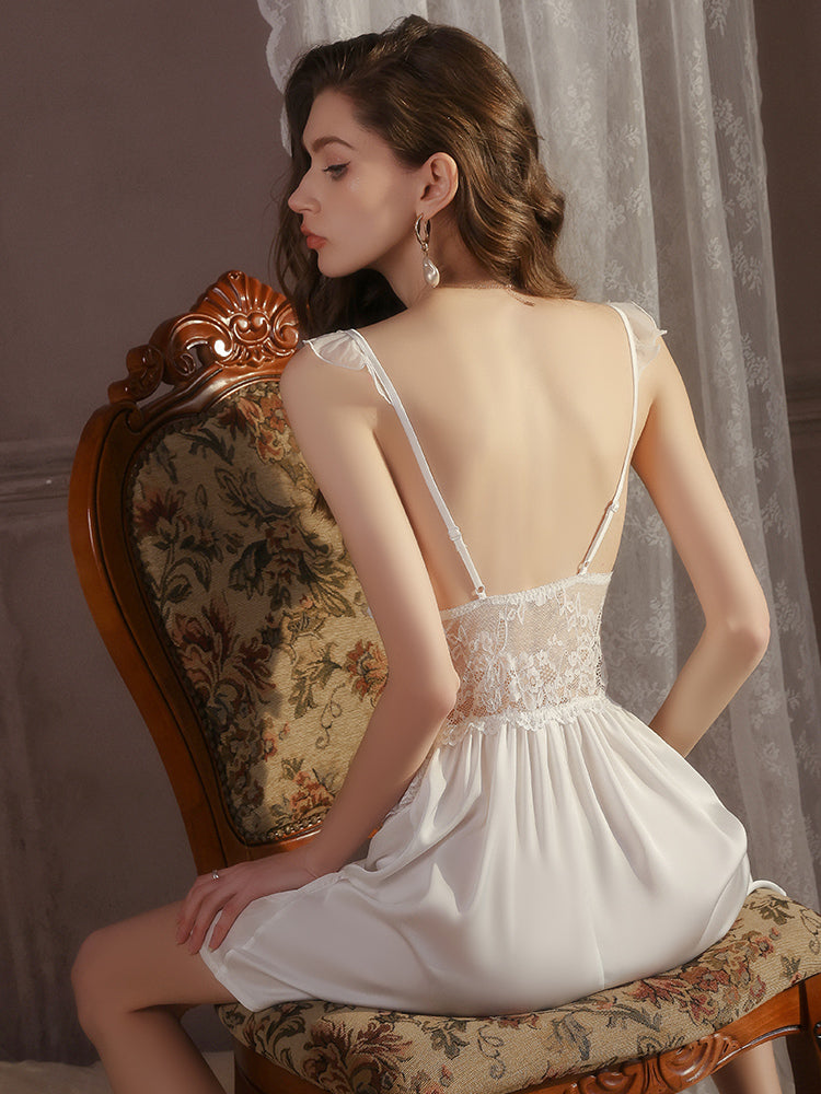 Woman in a white Lace Trim Sheer Long Robe & Satin Babydoll Nightgown sitting on an ornate chair with sheer curtains in the background