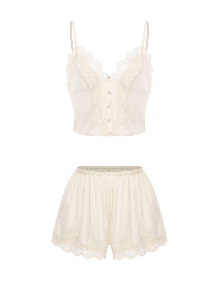 Cream-colored lingerie set with a top and shorts on a white background