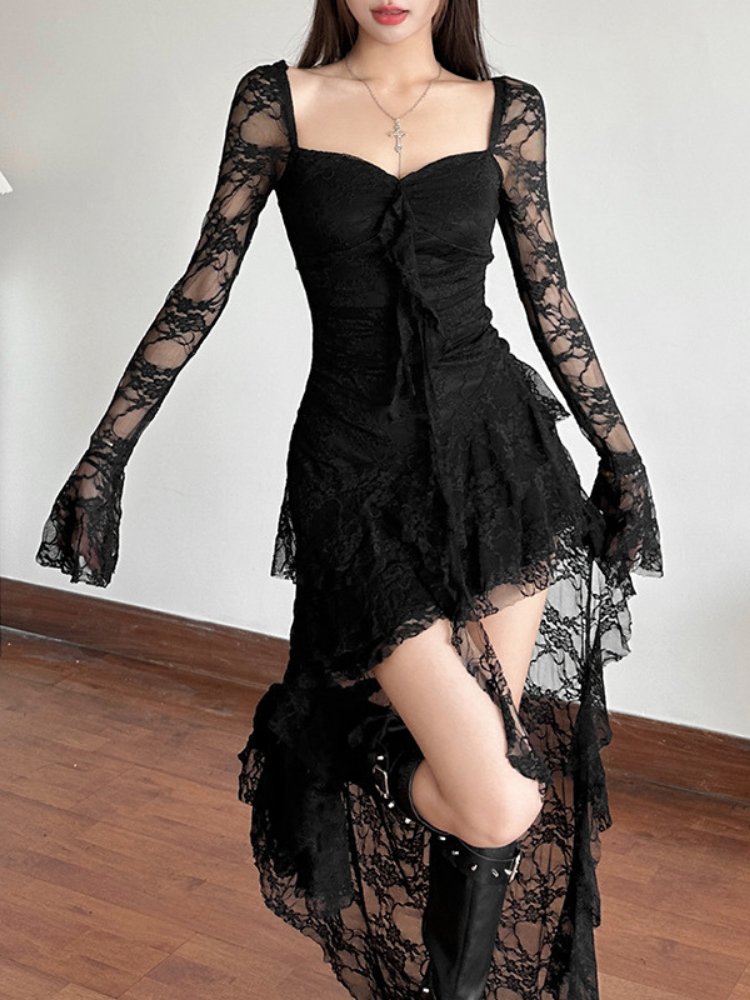 Black lace dress with long sleeves and floral details on a plain background