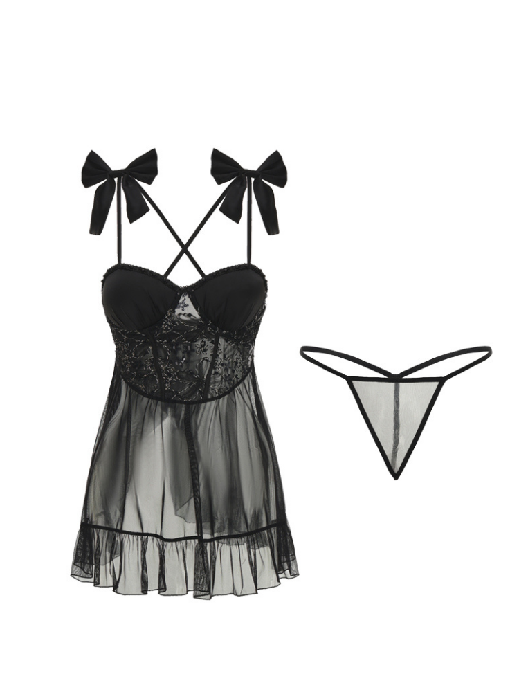 Black lace lingerie set with bows and sheer skirt on a white background