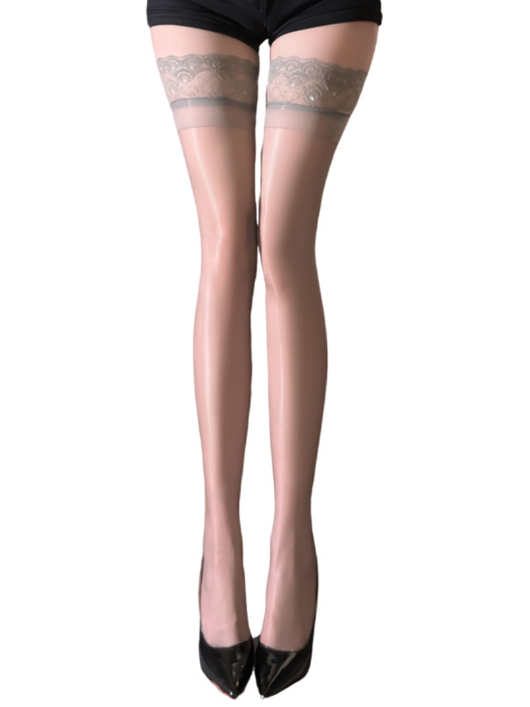 Sheer stockings with lace top Sheer Gloss Lace Top Thigh High Stockings Silicone Hold Ups worn by a person on a white background