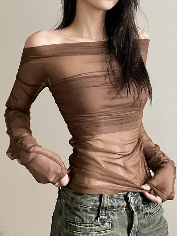 Brown off-shoulder top worn by a person on a plain background