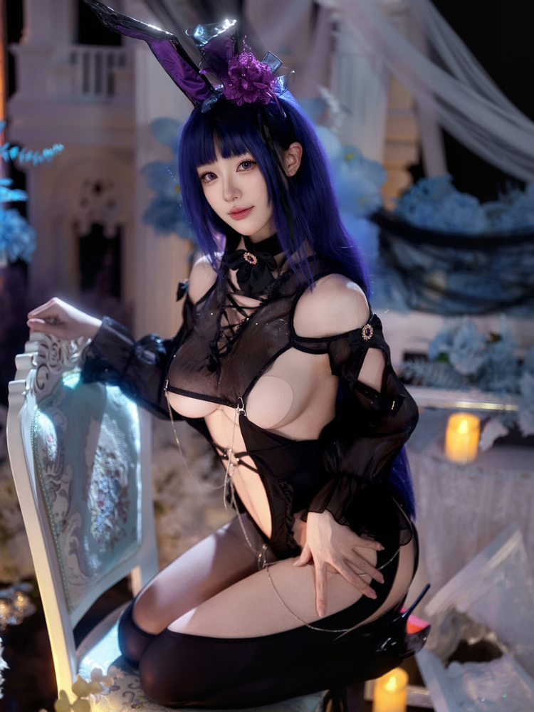 Person in a Black Sheer Lace Cutout Bunny Costume Sexy Lingerie Bodysuit with bunny ears in an elegant indoor setting