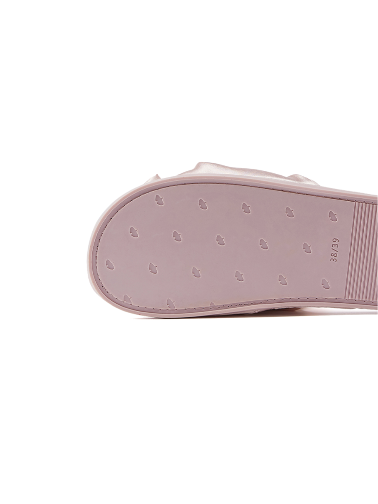 Pink satin bow quilted slippers close up heel view quilted insole