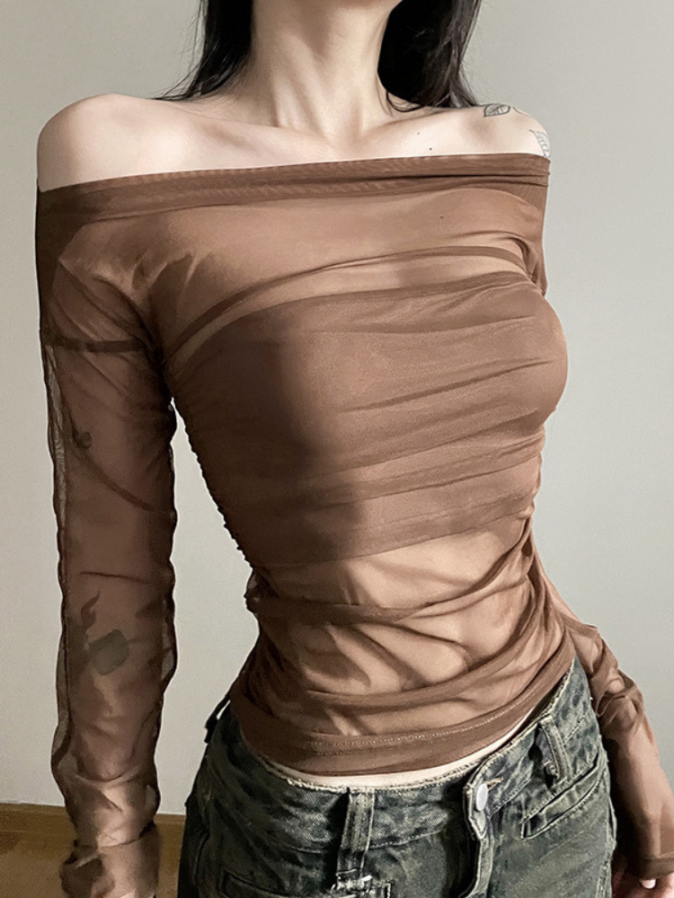 Brown off-shoulder long-sleeve top worn by a person against a neutral background