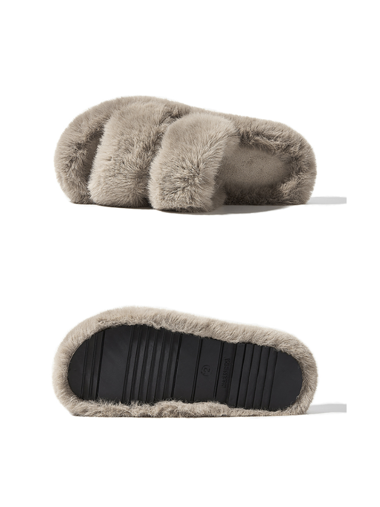Gray fuzzy slippers side view placed on surface double strap structure