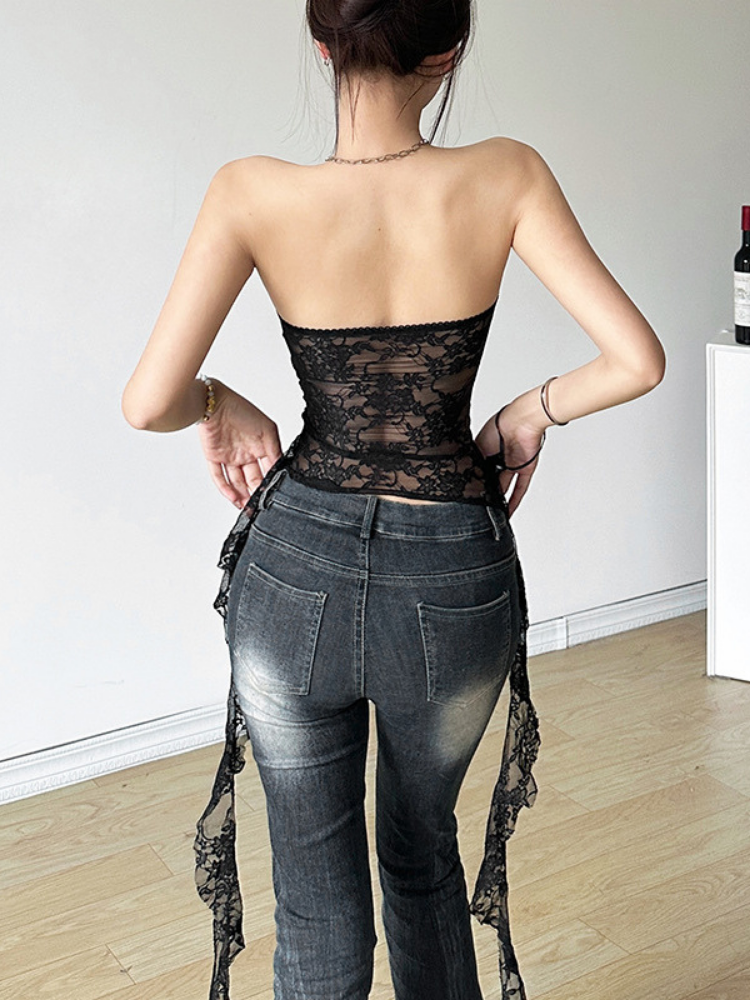 Person wearing a black Strapless Lace Mesh Tube Top and gray jeans with a white background