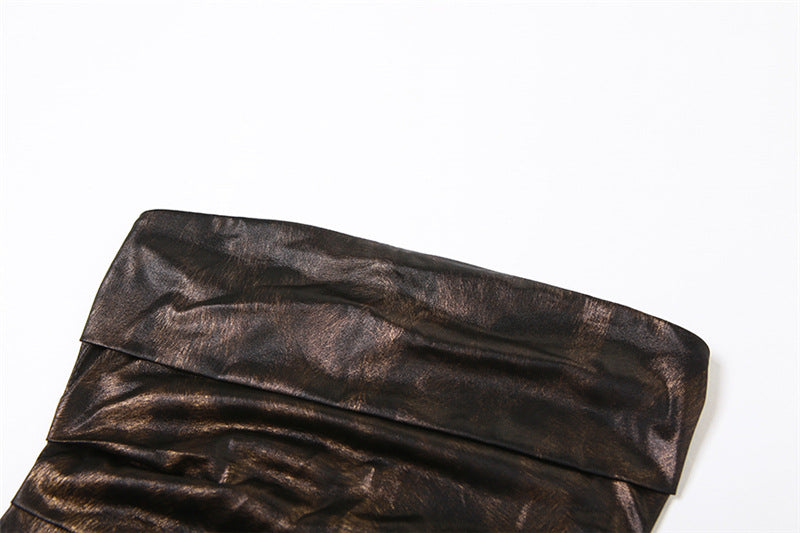 Close-up of a brown leather clutch bag on a white background