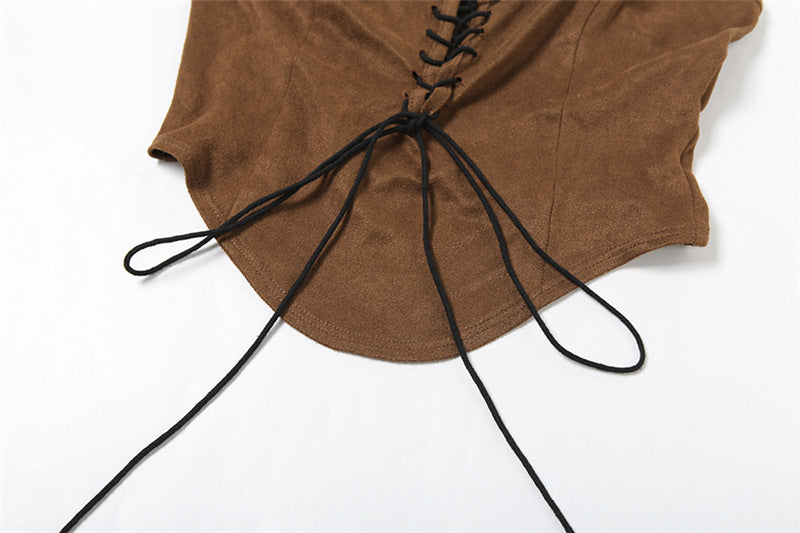Brown top with black lace-up details on a white background