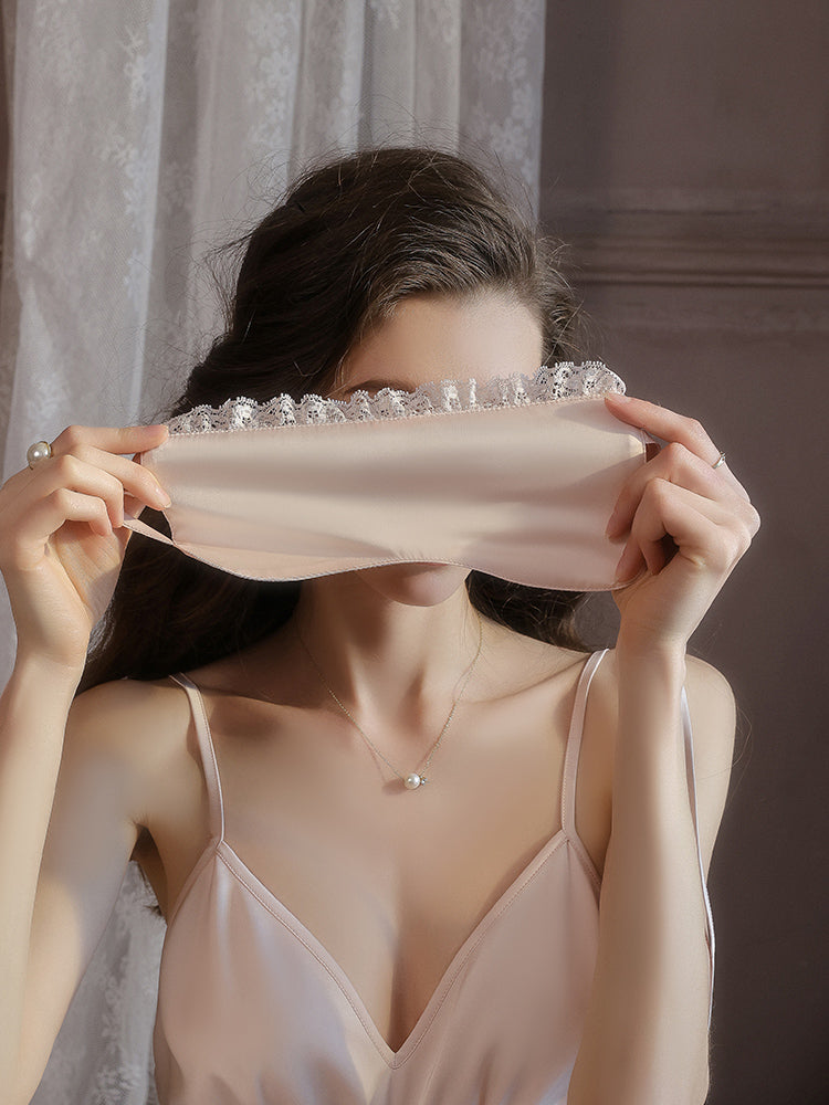 Woman holding a pink Lace Trim Satin Sleep Mask Blindfold