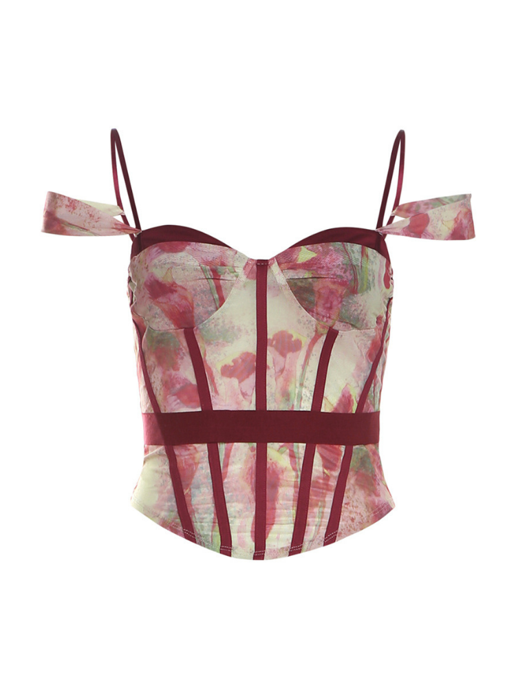 Floral-patterned top with red straps on a white background