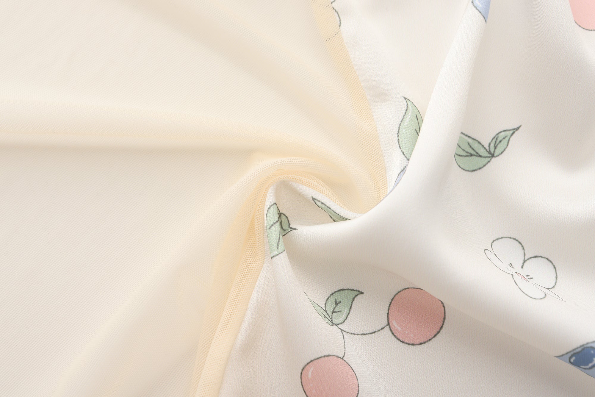 Fabric with cherry blossom pattern on a light background