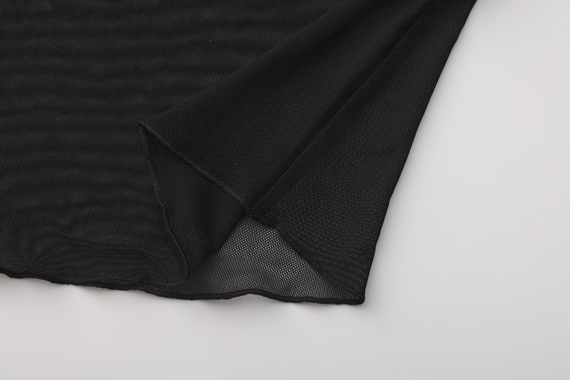 Black textured fabric on a white background