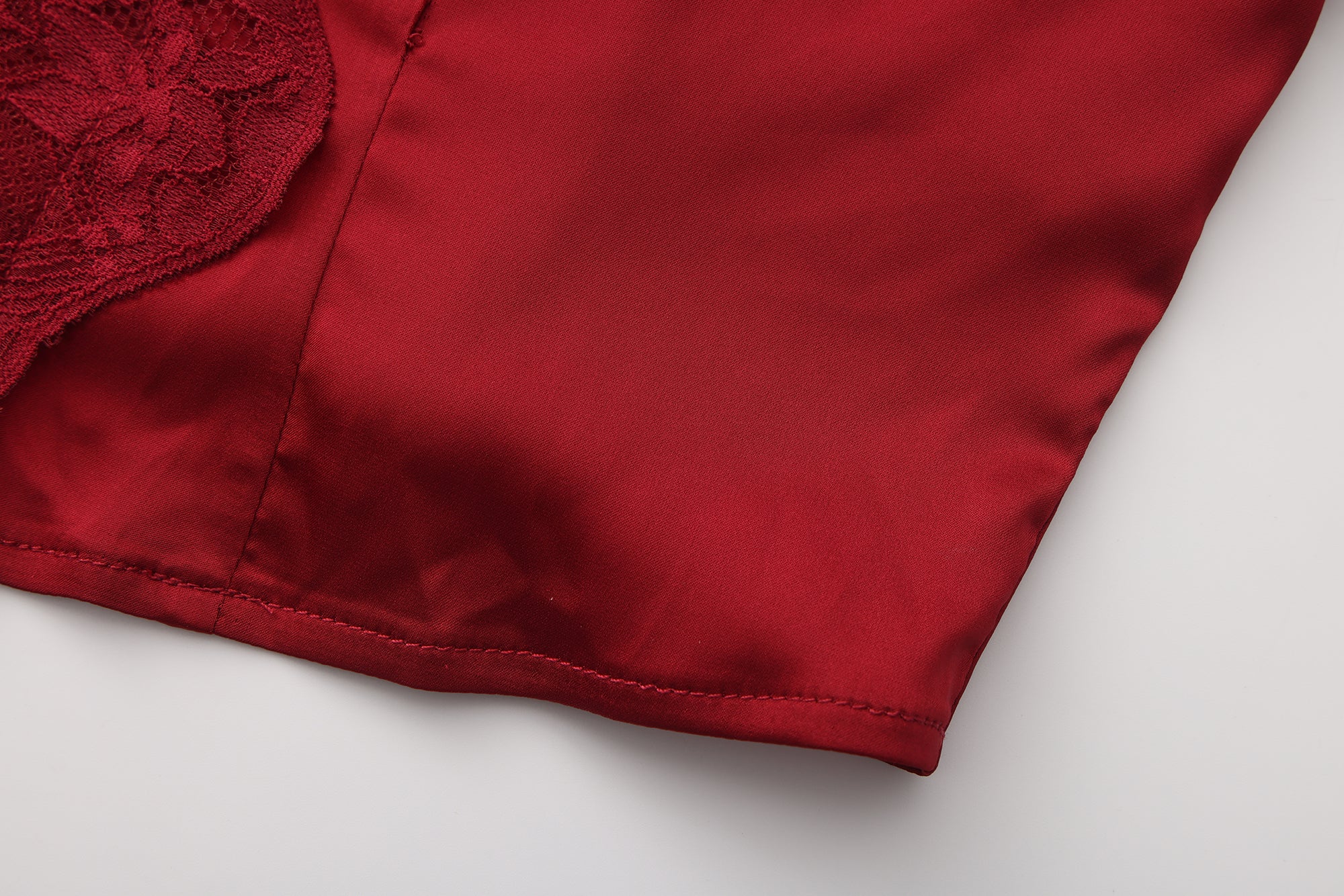 Close-up of a red fabric texture on a white background