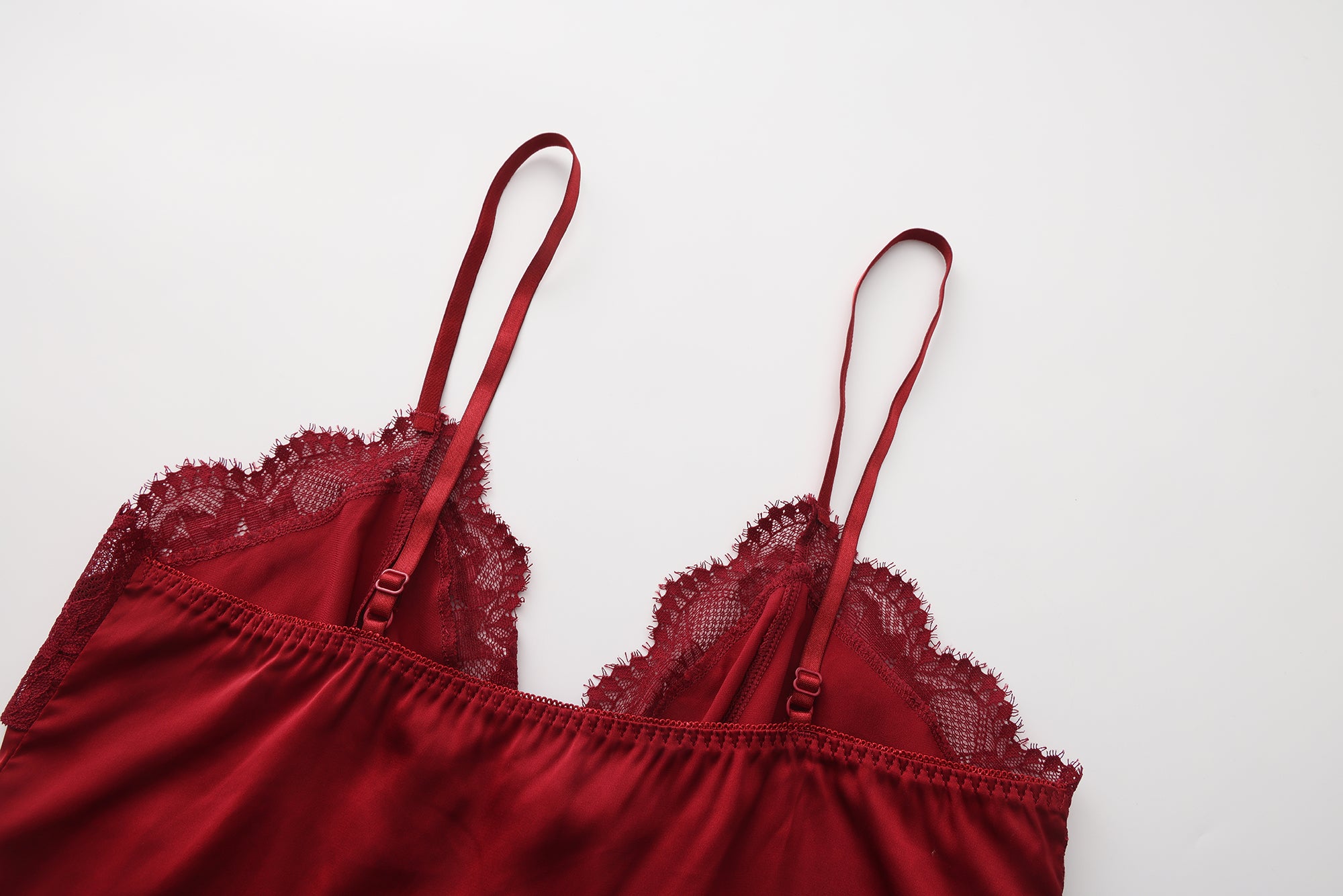 Red lace lingerie set on a white background
