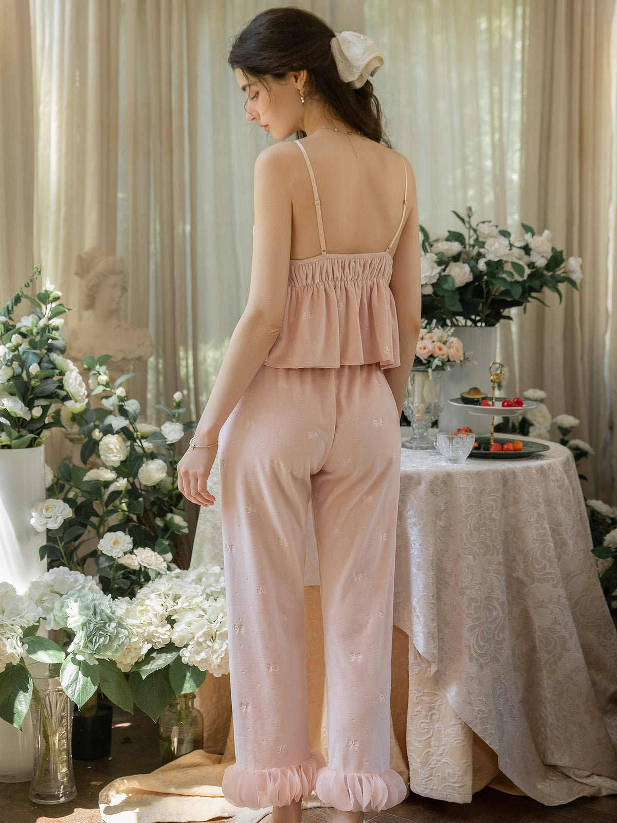 Pink bow print camisole and pajama pants rear view showing gathered back