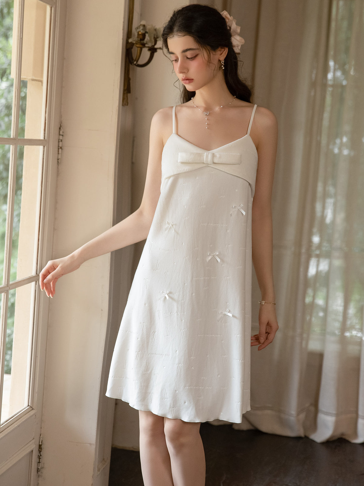 Ivory bow applique knee length slip dress front view