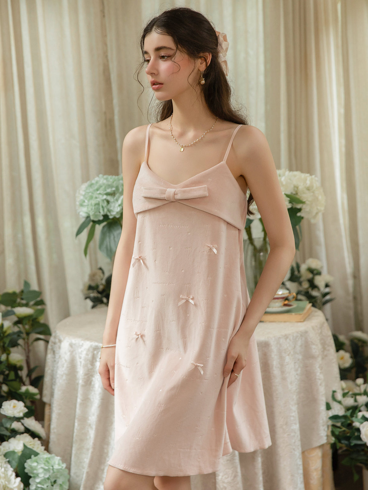 Pink folded bow bodice knee length nightdress front view