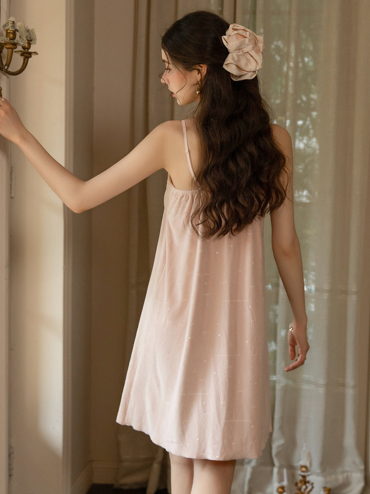 Pink bow applique slip dress rear view showing thin shoulder straps