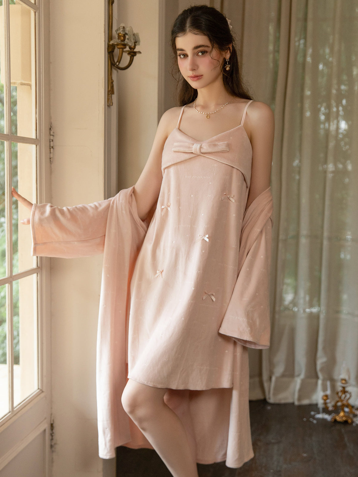 Pink long sleeve wrap robe worn open over coordinating bow applique slip dress