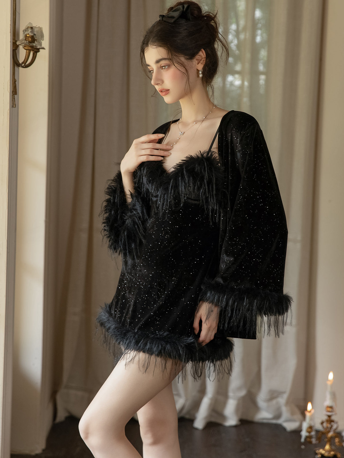 Black long sleeve velvet robe worn open over coordinating plush hem nightdress