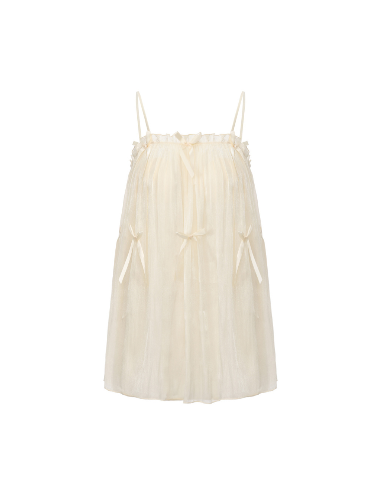 Ivory bow detail babydoll nightgown laid flat showing gathered top edge