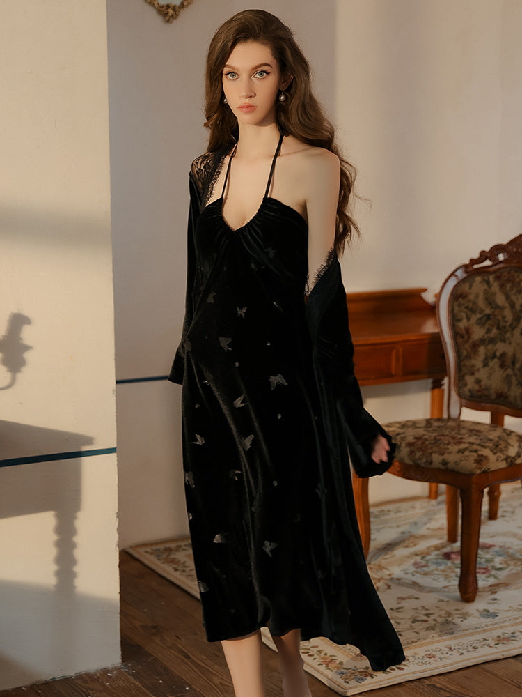 Black butterfly velvet dress walking forward with robe near chair