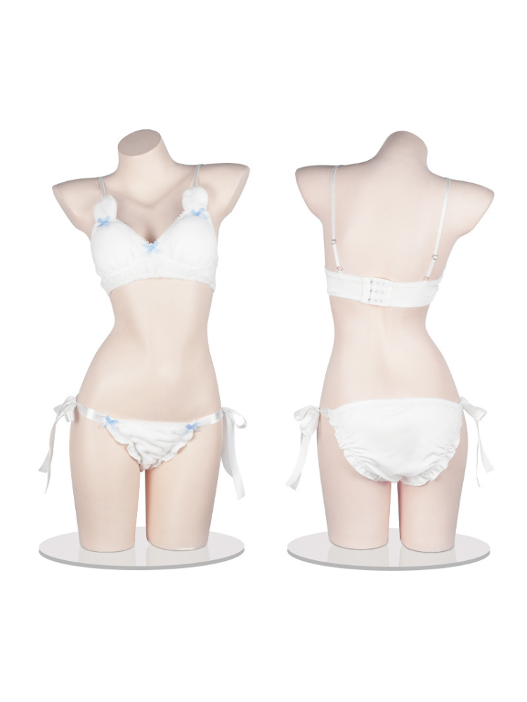 Mannequin display of a two piece white lingerie set featuring blue bow details and ribbon ties, shown from front and back views.