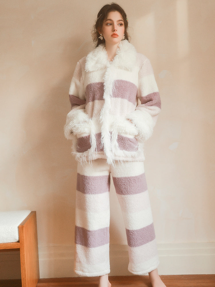 Person wearing a white and purple striped outfit with a fluffy texture against a plain background