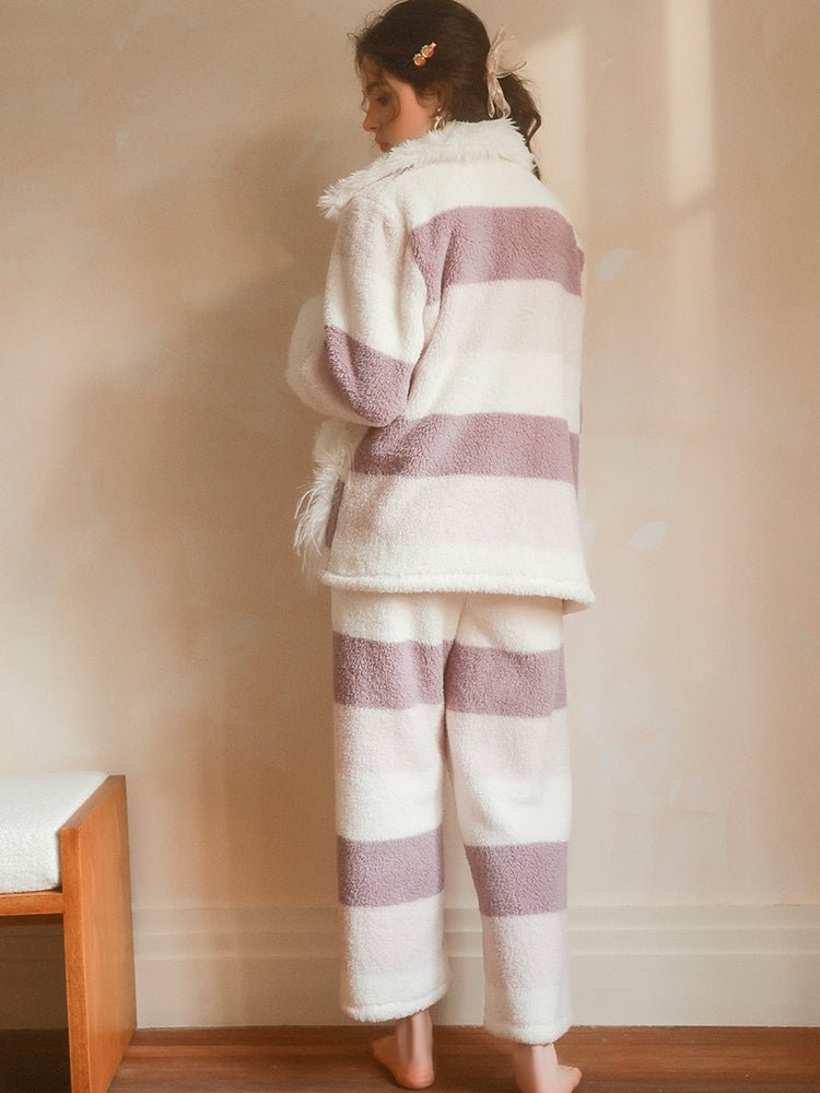 Person wearing a Plush Stripe Mauve White outfit in a room with a wooden bench.