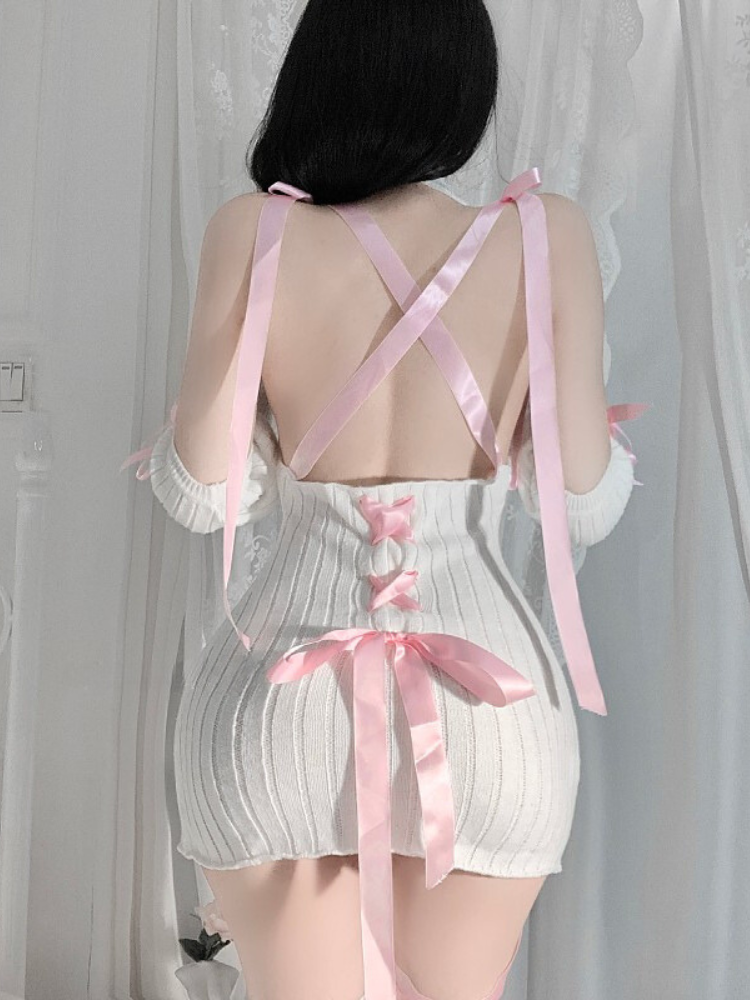 Back view of ribbed knit mini dress with crisscross ribbons and open back.