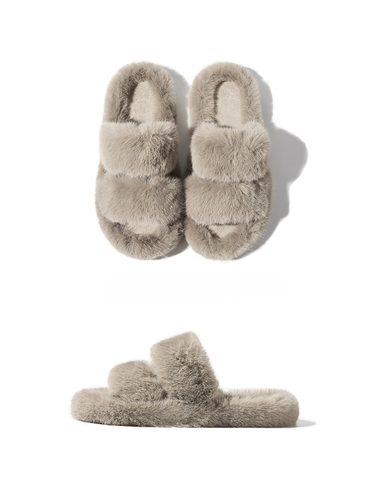 Grey fuzzy slippers front and side view placed on white background soft fur