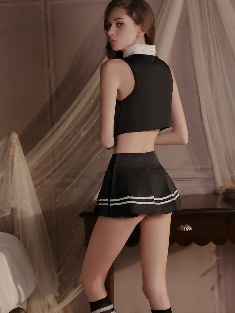 Back view of a black satin lingerie set with a contrasting white collar and pleated mini skirt highlighted by white stripe accents.