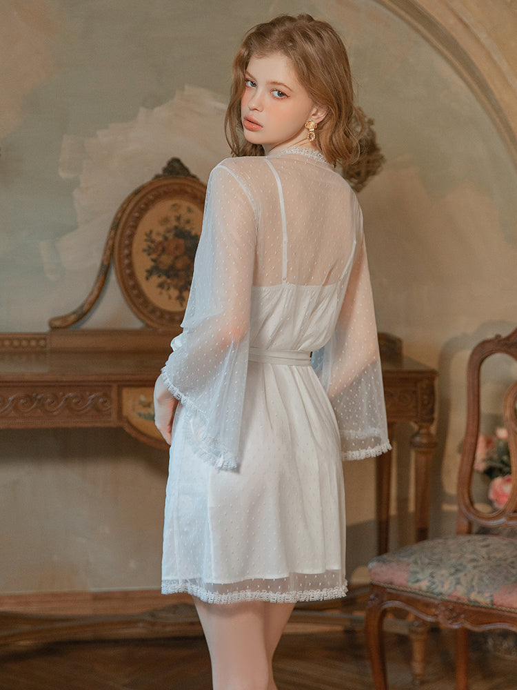 Woman wearing a white lace dress in an elegant room with decorative furniture. white slip dress, lace slip dress, babydoll nightgown, sheer lingerie, Swiss dot mesh, white lingerie, sexy sleepwear.