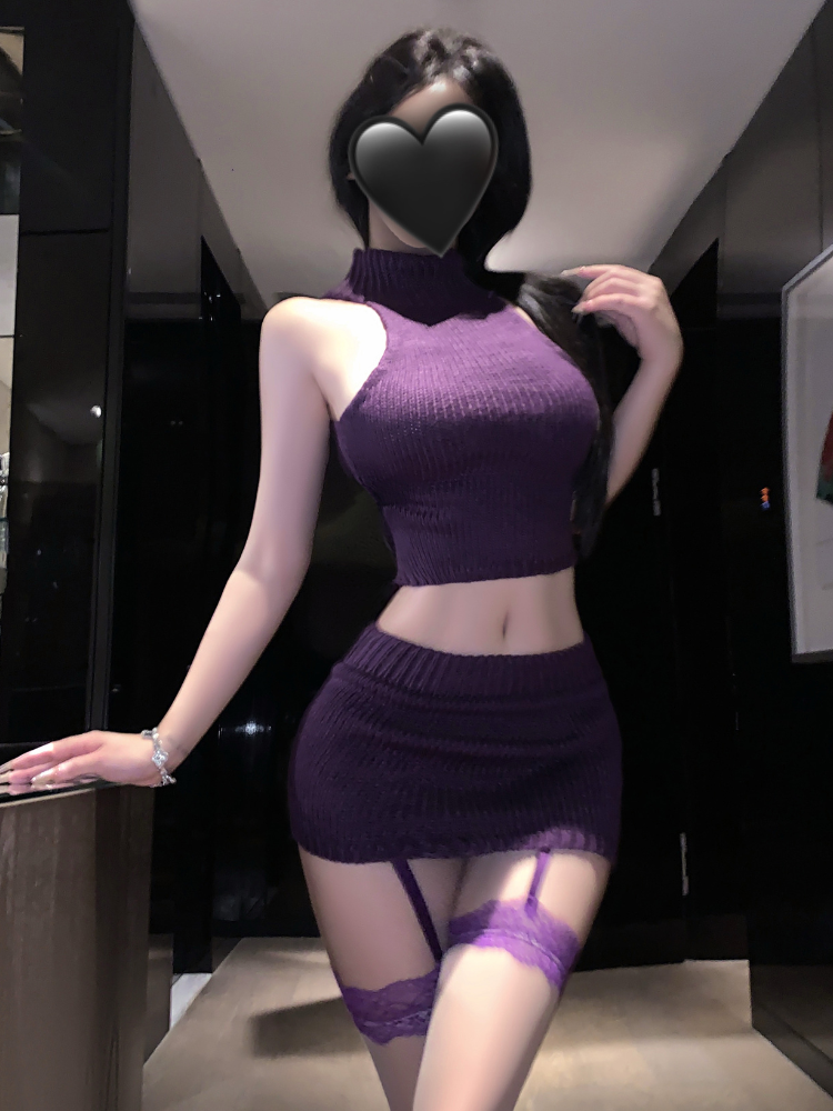 Person wearing a purple Ribbed Halter Crop Top Skirt Set in an indoor setting