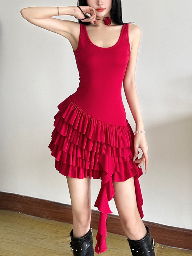 Close up of a red ruffled mini dress highlighting the layered skirt and asymmetrical hem.