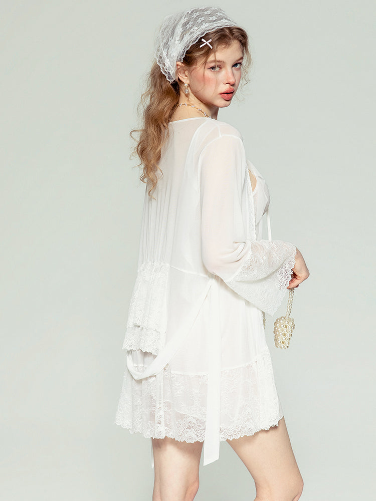 Woman wearing a white lace nightgown with a sheer cover-up against a light gray background sheer mesh babydoll dress, slip dress, see through lingerie, transparent lingerie, mesh dress, sleep dress, lingerie dress.