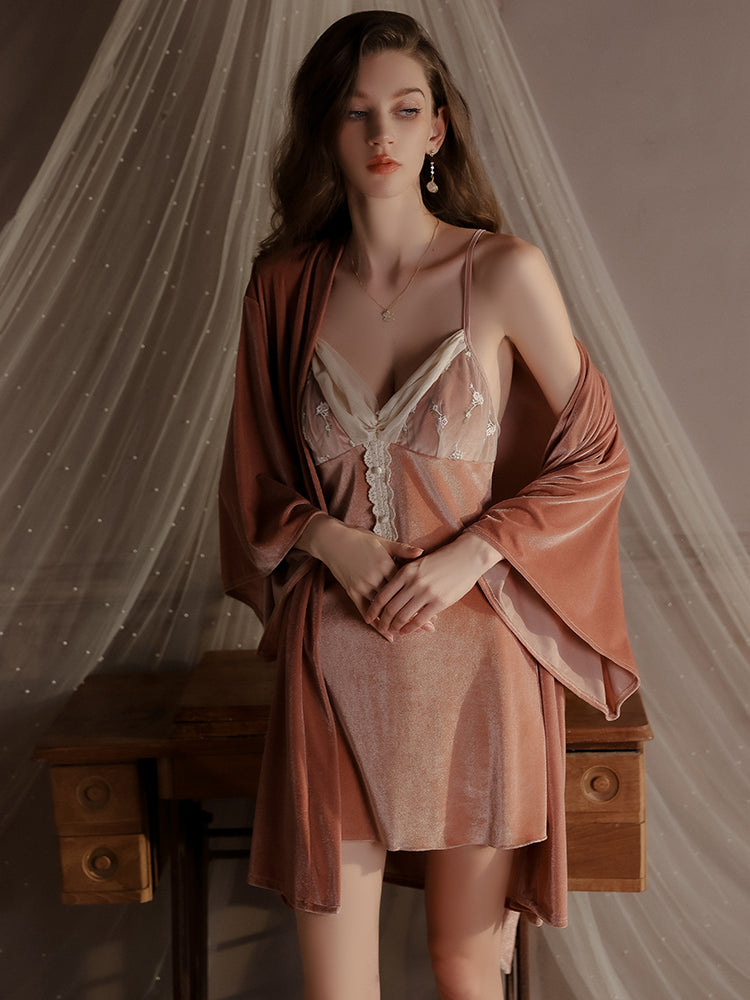 Rust velvet slip dress with matching robe - A rust-colored velvet slip dress paired with a matching robe, featuring floral embroidery and lace buttons, styled in a luxurious and elegant lounge setting.