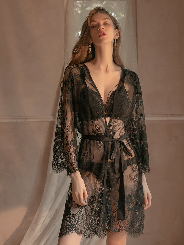 Front view of the black Sheer Lace Robe Set with Satin Details, emphasizing the V neckline, floral lace bra, and airy sheer robe with a satin bow.